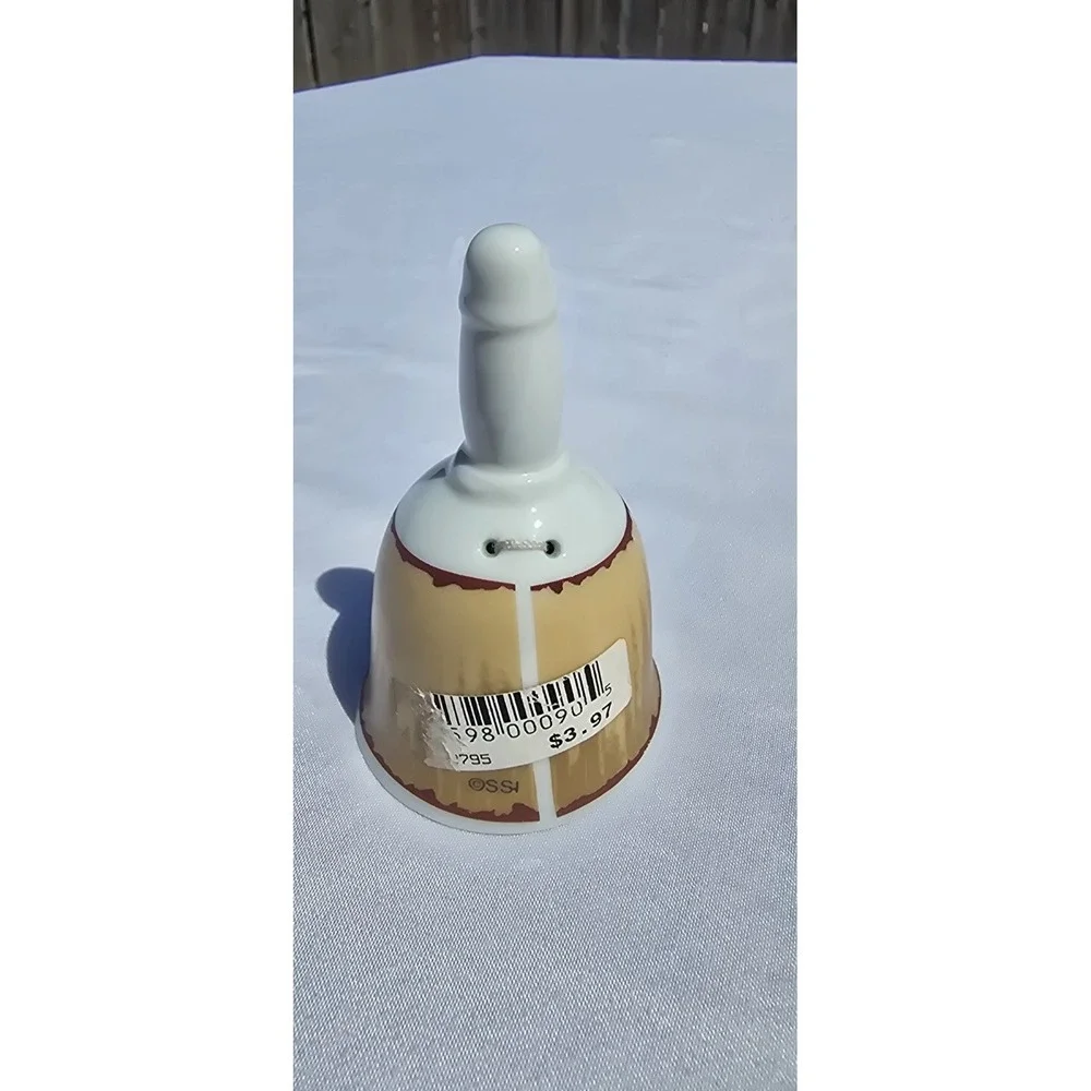 vintage/collectible porcelain souvenir bell featuring a map graphic of Colorado